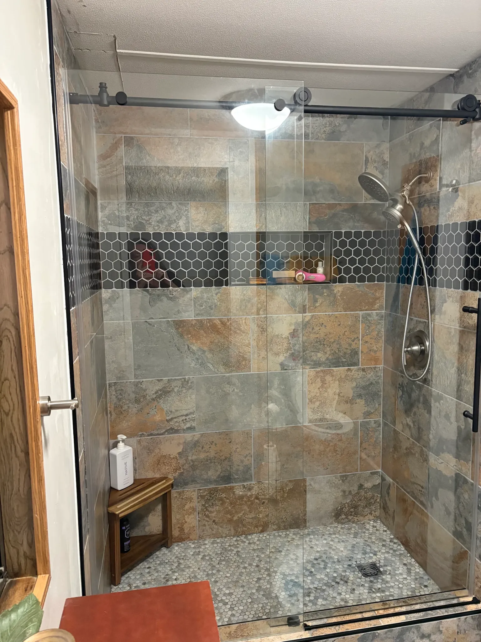 Completed tiled shower with sliding glass doors