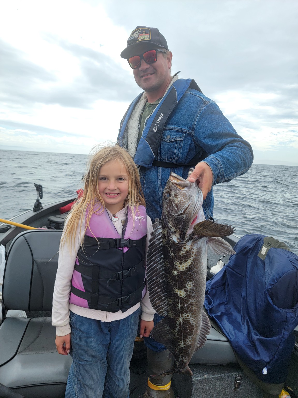 Willie fishing with his child off the coast